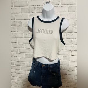 White and black “xoxo” sequins crop top and KENDALL+ KYLIE denim shorts